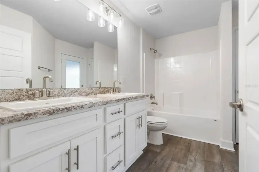 Representative furnished interior of a home built from the 2265 by Adams Homes in Flagler Estates, Hastings (Image 17).
