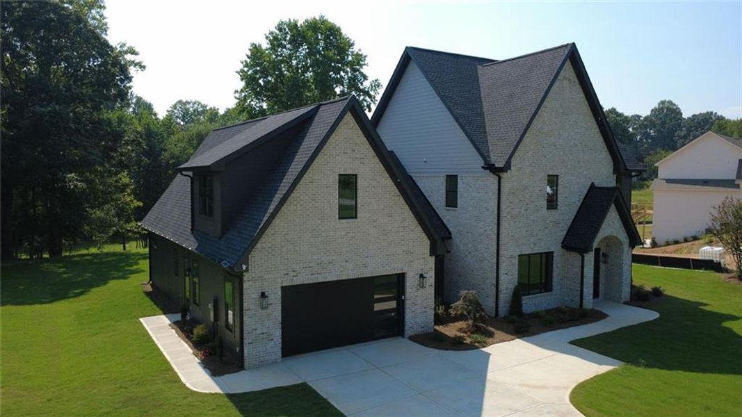 Front exterior of a new home in , Flowery Branch, GA, highlighting curb appeal (Image 28).