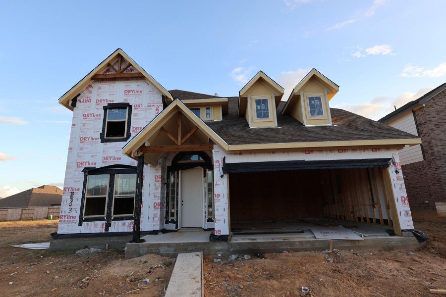 Two story home with 4 beds, 3.5 baths, and 2 car garage.