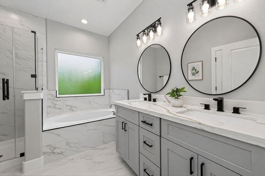 Modern, spa-like primary bathroom with high-end finishes and a clean, elegant design.