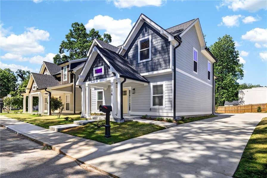 Front exterior of a new home in , Hapeville, GA, highlighting curb appeal (Image 26).
