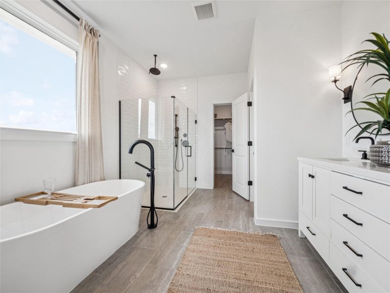 Luxurious primary bath (*Photo not of actual home and used for illustration purposes only.)