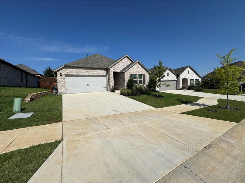 Single-story residence featuring light-colored brick exterior Single-story residence featuring light-colored brick exterior