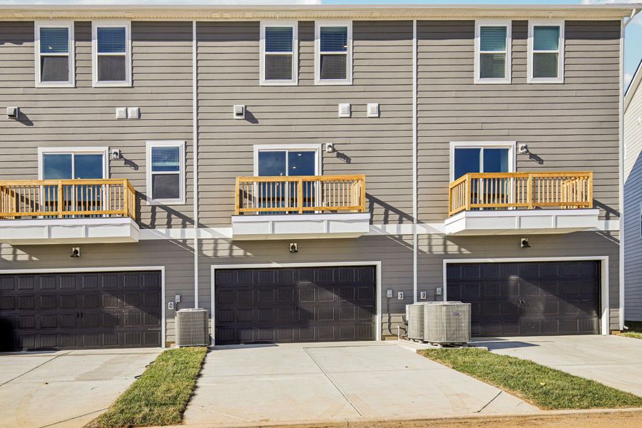 Exterior details and patio area of a home in Greystone - Highland Townhomes, Smyrna (Image 3).