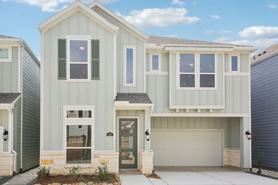 Front exterior of a new home in Kemah Crossing - Luxe Series, Kemah, TX, highlighting curb appeal (Image 1). Front exterior of a new home in Kemah Crossing - Luxe Series, Kemah, TX, highlighting curb appeal (Image 1).
