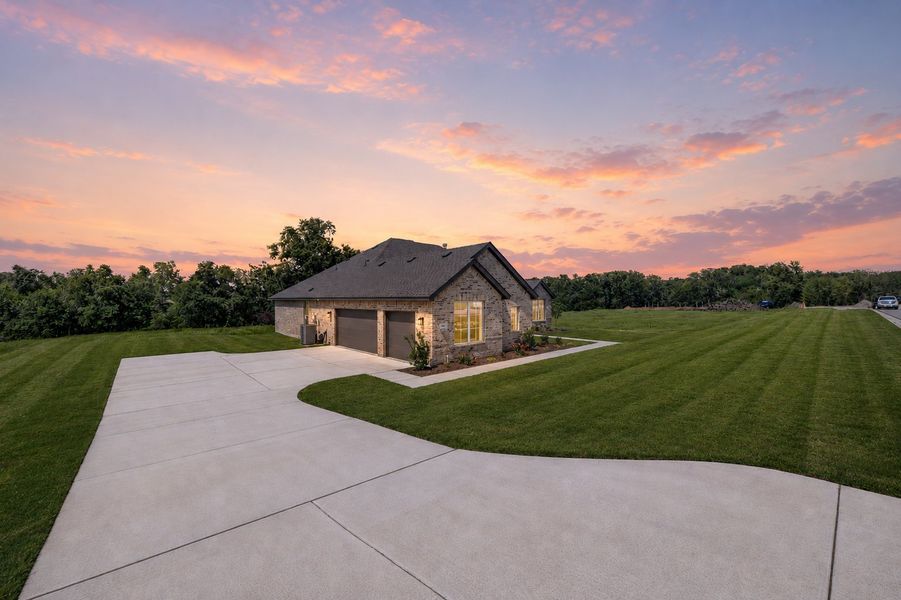 Front exterior of a new home in Terra Vista Estates, Springtown, TX, highlighting curb appeal (Image 23). Front exterior of a new home in Terra Vista Estates, Springtown, TX, highlighting curb appeal (Image 23).