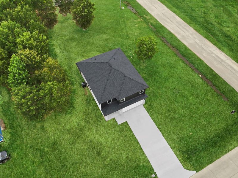 Front exterior of a new home in , Cleveland, TX, highlighting curb appeal (Image 31). Front exterior of a new home in , Cleveland, TX, highlighting curb appeal (Image 31).