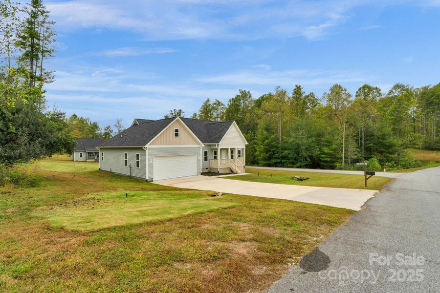 Front exterior of a new home in , Hendersonville, NC, highlighting curb appeal (Image 2).