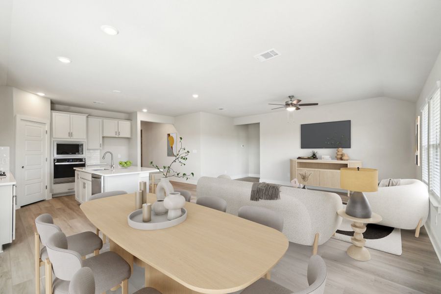 Virtually staged dining room in in the Preston floorplan at a Meritage Homes community.