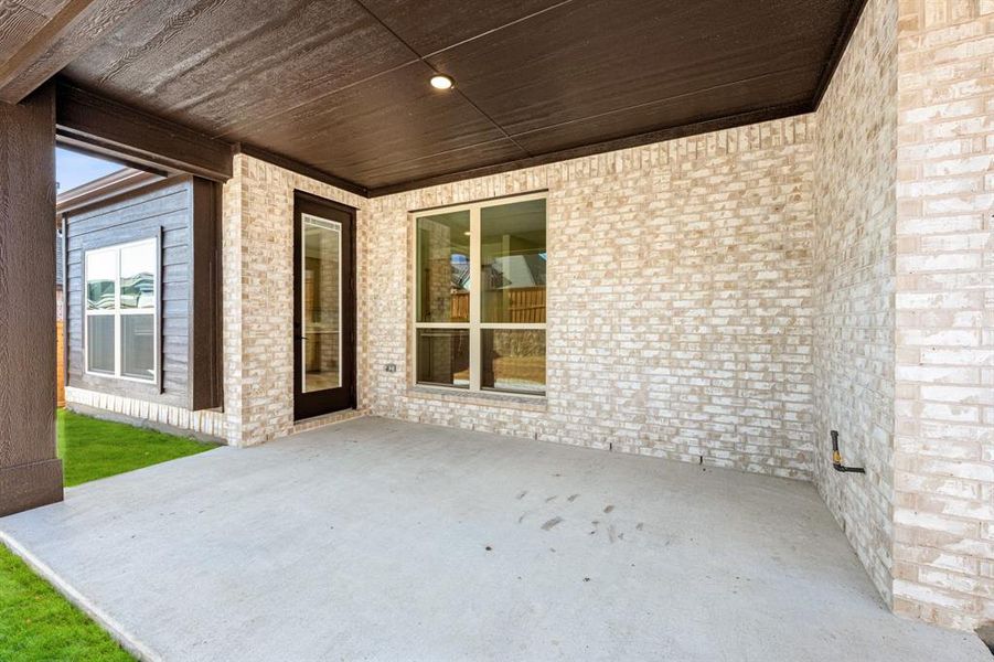 Exterior details and patio area of a home in Windsong Ranch, Prosper (Image 4).
