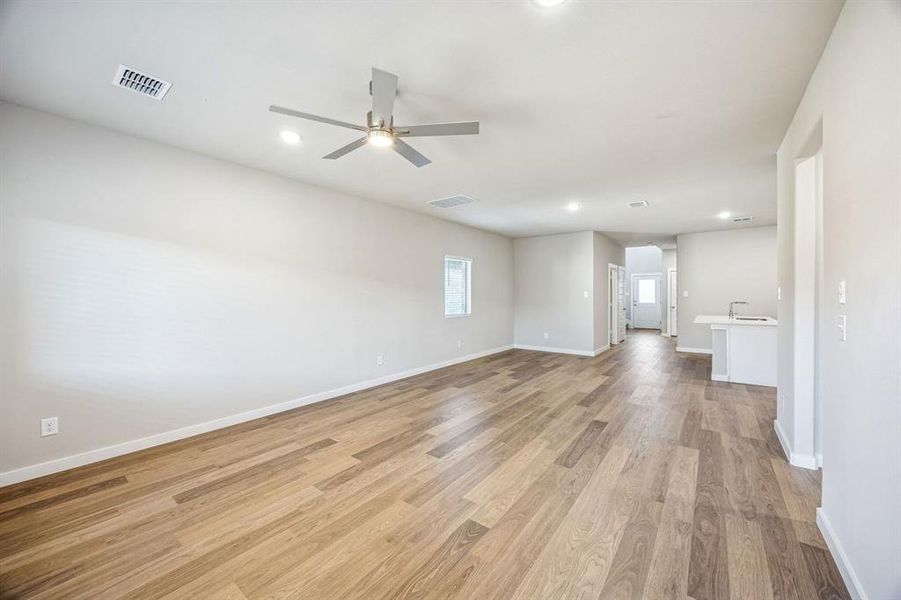 Living and Dining Room in the Willow home plan by Trophy Signature Homes – REPRESENTATIVE PHOTO