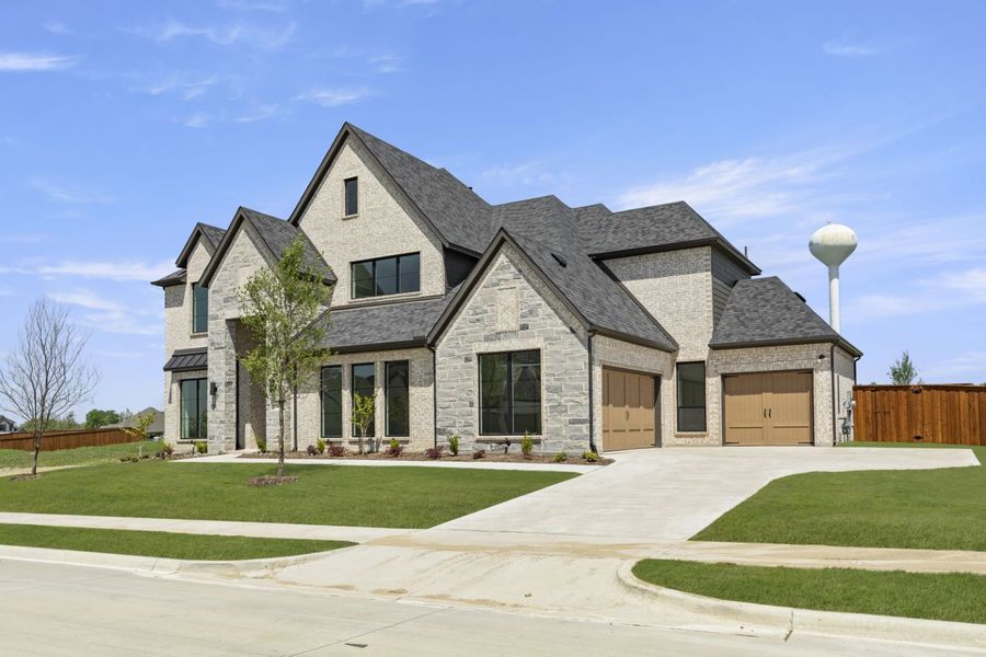 Representative exterior photo of a completed home built from the SL-Oxford by Windsor Homes in Ridge Pointe Estates, McLendon-Chisholm, TX (Image 1). Representative exterior photo of a completed home built from the SL-Oxford by Windsor Homes in Ridge Pointe Estates, McLendon-Chisholm, TX (Image 1).