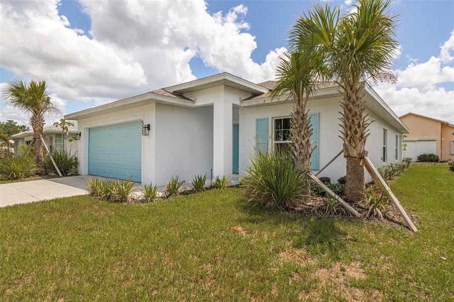 Front exterior of a new home in , Port Charlotte, FL, highlighting curb appeal (Image 24).