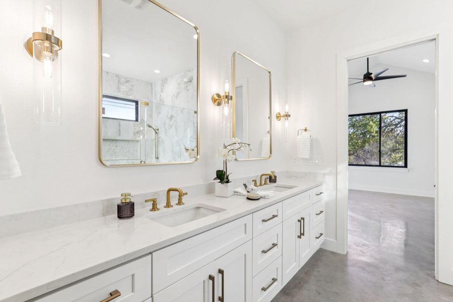 Enjoy an elegant en-suite bath with double vanities.