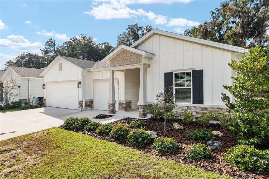 Front exterior of a new home in Finley Woods, Gainesville, FL, highlighting curb appeal (Image 27). Front exterior of a new home in Finley Woods, Gainesville, FL, highlighting curb appeal (Image 27).