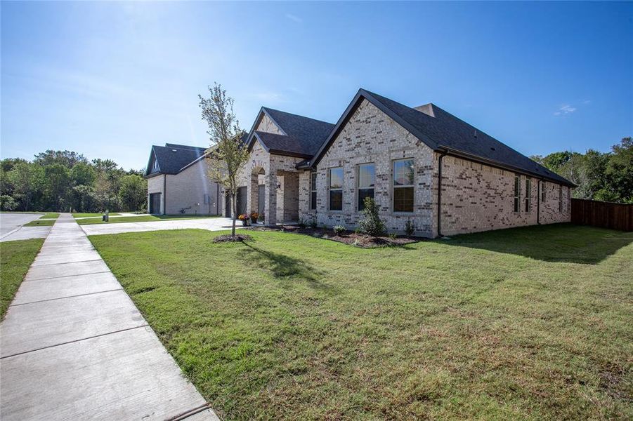 View of front of property with a front yard