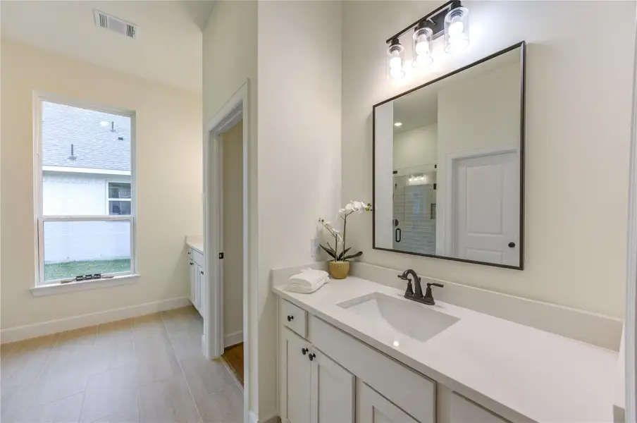 This bright and inviting bathroom features elegant fixtures, ample natural light, and modern finishes, creating a serene oasis for relaxation. This bright and inviting bathroom features elegant fixtures, ample natural light, and modern finishes, creating a serene oasis for relaxation.