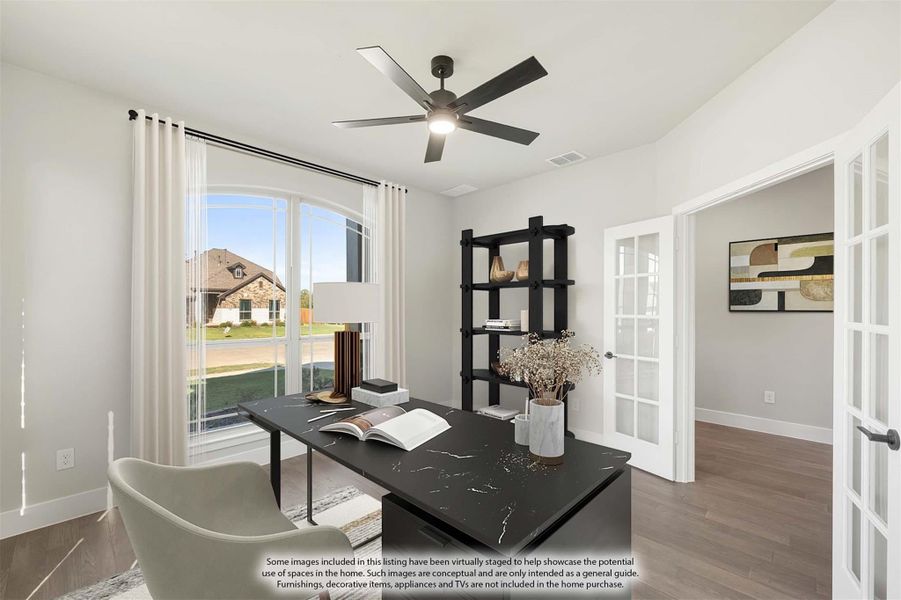 Home office with dark marble desk, black shelving, ceiling fan, and French doors on hardwood floors