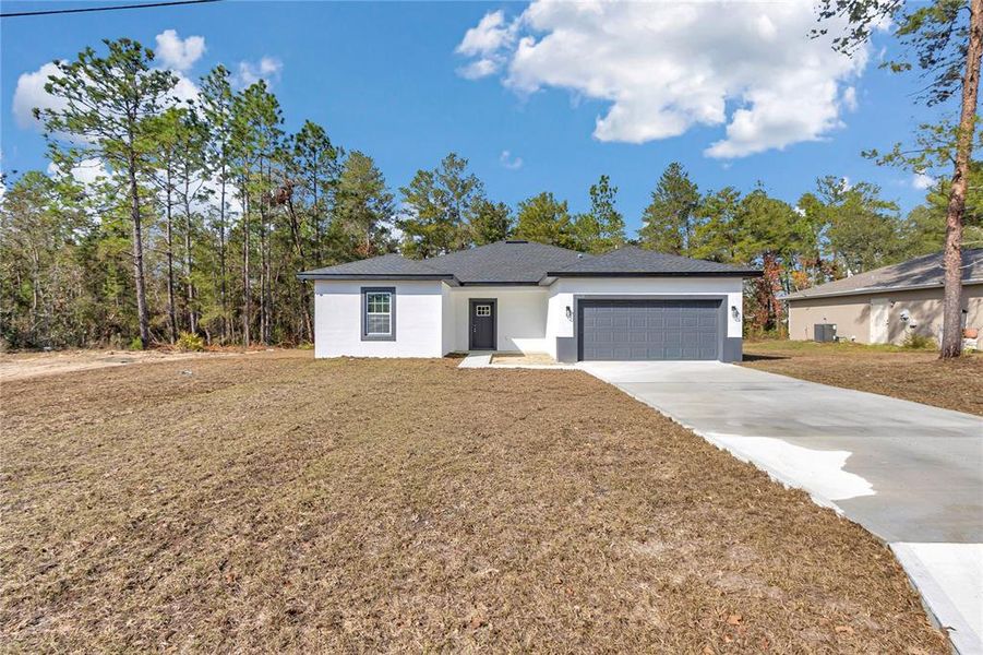 Front exterior of a new home in , Ocala, FL, highlighting curb appeal (Image 19).