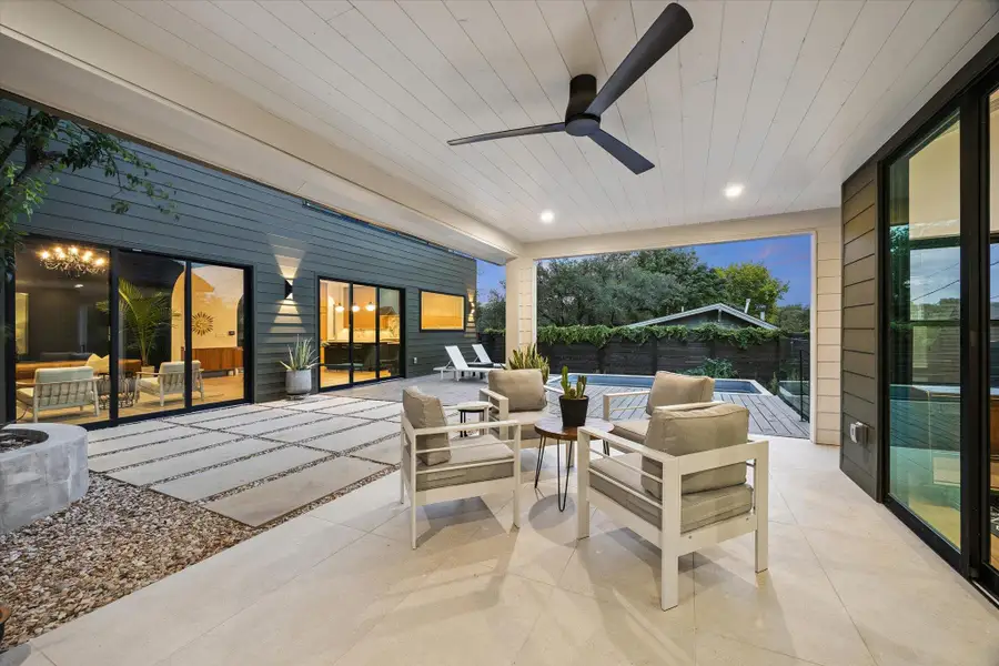 View of patio featuring ceiling fan, outdoor lounge area, and outdoor dining space View of patio featuring ceiling fan, outdoor lounge area, and outdoor dining space