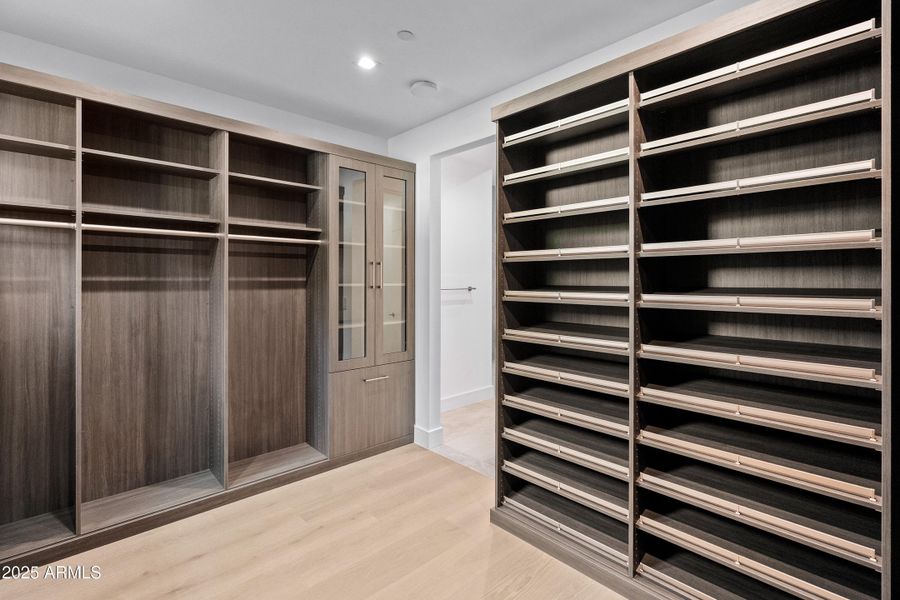 Primary Walk-In Closet (1 of 2) Primary Walk-In Closet (1 of 2)