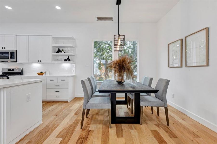 The inviting dining area is located just right off the kitchen. (Model Unit 9424C)