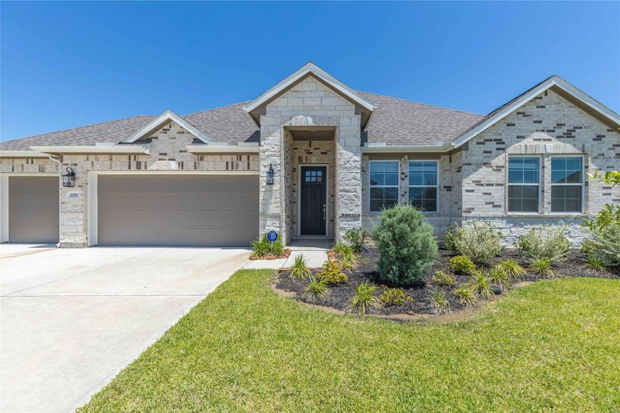 Front exterior of a new home in River Ranch Estates, Dayton, TX, highlighting curb appeal (Image 2).