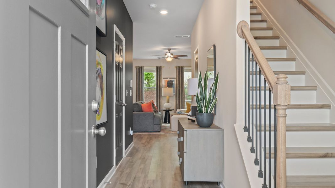 Front door entry area with stairs to second floor and hall to main level