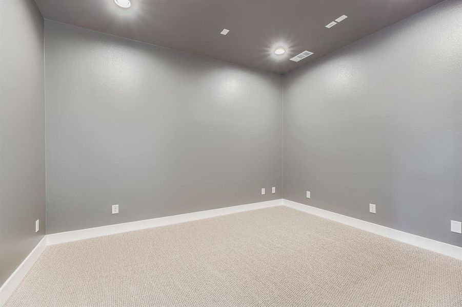 Spare room featuring carpet floors and recessed lighting
