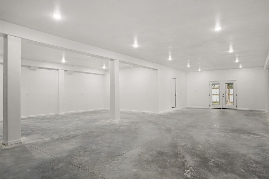 A second view of the massive garage with french doors to the back patio.