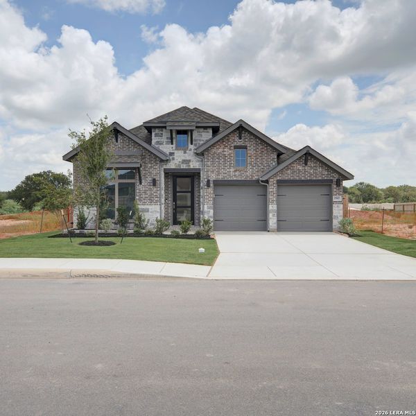 Front exterior of a new home in Alsatian Oaks, Castroville, TX, highlighting curb appeal (Image 2).