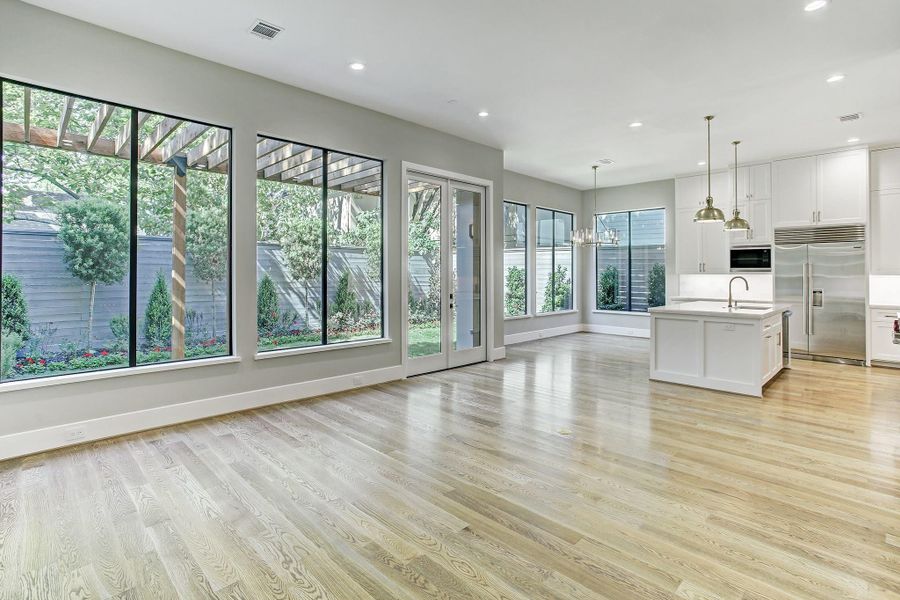 The family room flows seamlessly into the gourmet kitchen and is prewired for automation, cameras and sound. The family room flows seamlessly into the gourmet kitchen and is prewired for automation, cameras and sound.