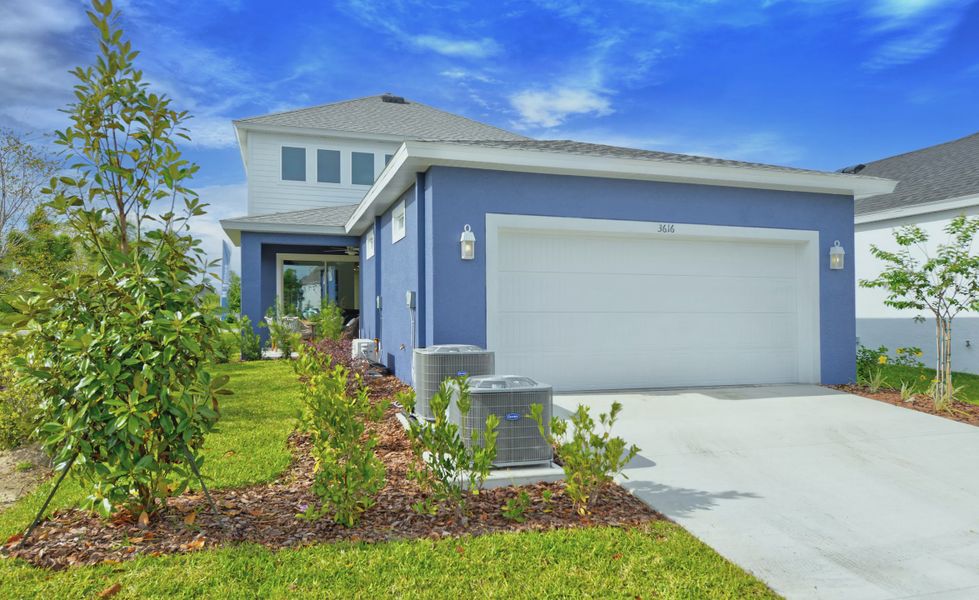 Front exterior of a new home in Persimmon Park, Wesley Chapel, FL, highlighting curb appeal (Image 20).