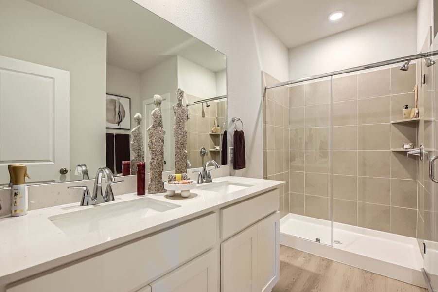 A bathroom with a large mirror. A bathroom with a large mirror.