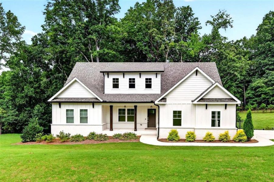 Front exterior of a new home in , Hoschton, GA, highlighting curb appeal (Image 31).