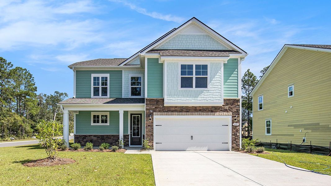 Front exterior of a new home in Heron Pointe, Myrtle Beach, SC, highlighting curb appeal (Image 2). Front exterior of a new home in Heron Pointe, Myrtle Beach, SC, highlighting curb appeal (Image 2).