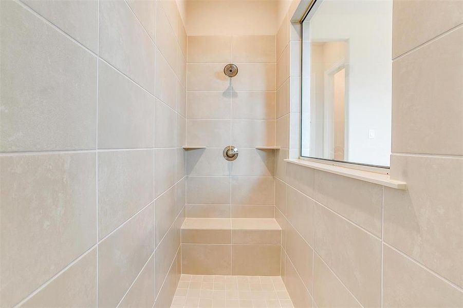 Bathroom with a tile shower