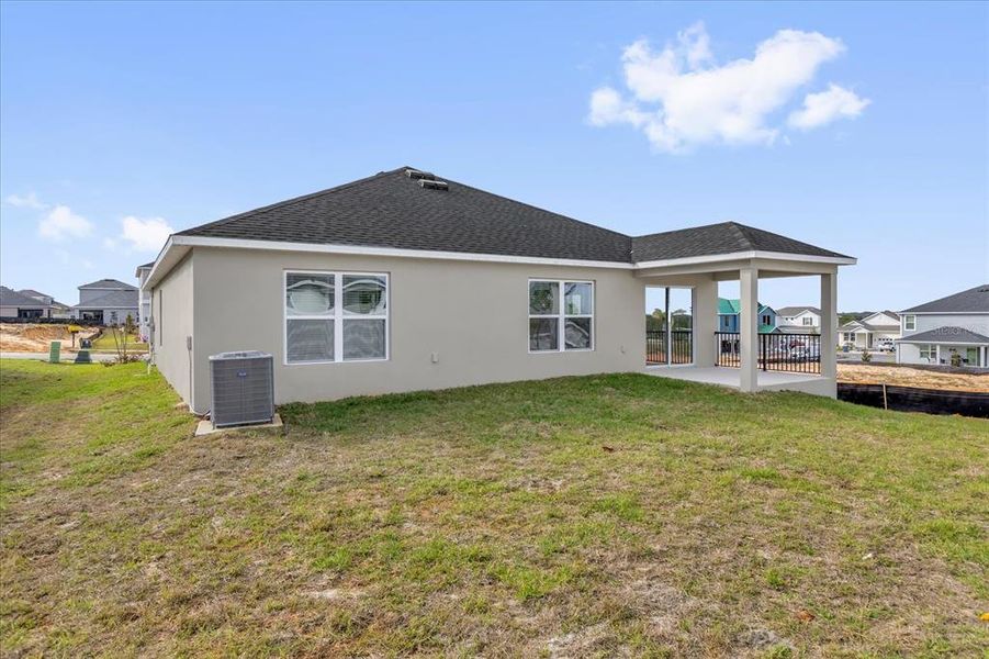 Exterior details and patio area of a home in , Groveland (Image 3).