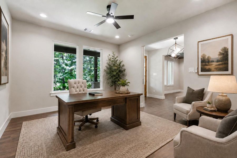 This study has a closet and is right next to a full bath so this could easily be a 6th bedroom. The neutral walls and recessed lighting create a modern and airy feel.