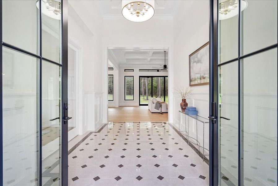 French 10 foot glass doors welcome you home.