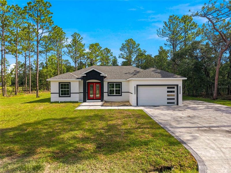 Front exterior of a new home in , Dunnellon, FL, highlighting curb appeal (Image 2). Front exterior of a new home in , Dunnellon, FL, highlighting curb appeal (Image 2).