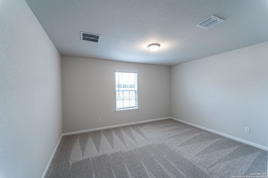 Spacious, unfurnished interior of a new home in The Woodlands at Medina Hills, Mico (Image 19).