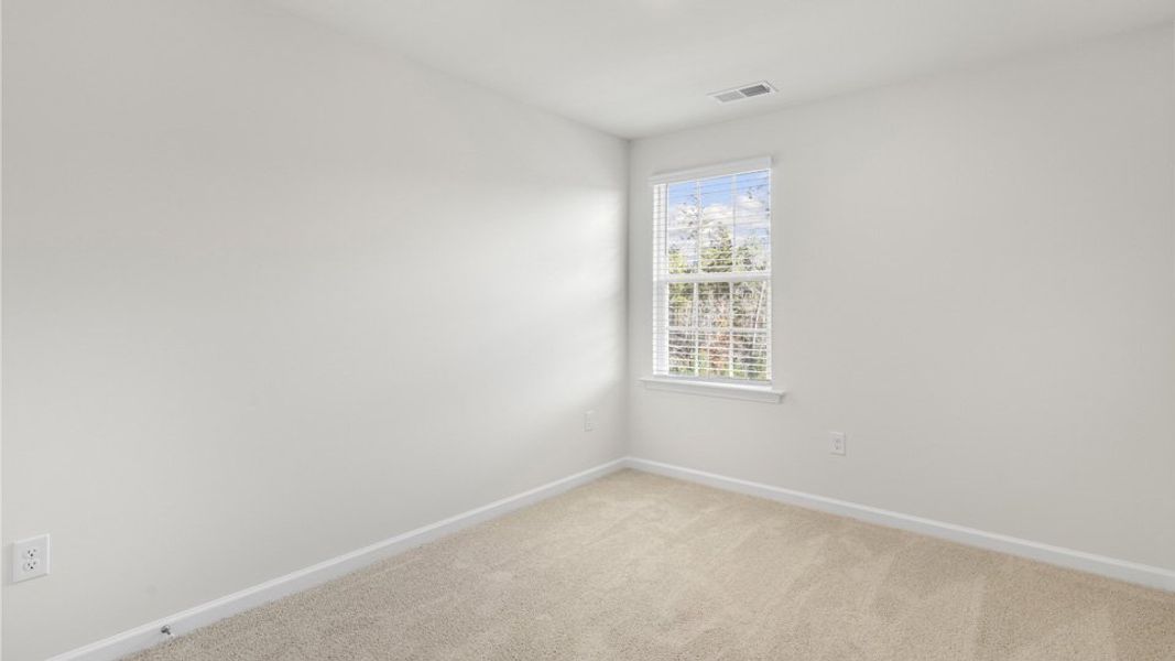 Spacious, unfurnished interior of a new home in The Townes at Galvins Ridge, Sanford (Image 25).