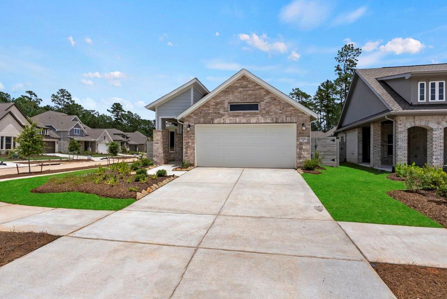 Front exterior of a new home in Two Step Farm, Montgomery, TX, highlighting curb appeal (Image 23). Front exterior of a new home in Two Step Farm, Montgomery, TX, highlighting curb appeal (Image 23).
