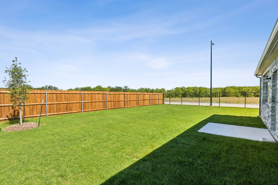 Yard/ Flatwork in the Sapphire home plan by Trophy Signature Homes – REPRESENTATIVE PHOTO Yard/ Flatwork in the Sapphire home plan by Trophy Signature Homes – REPRESENTATIVE PHOTO