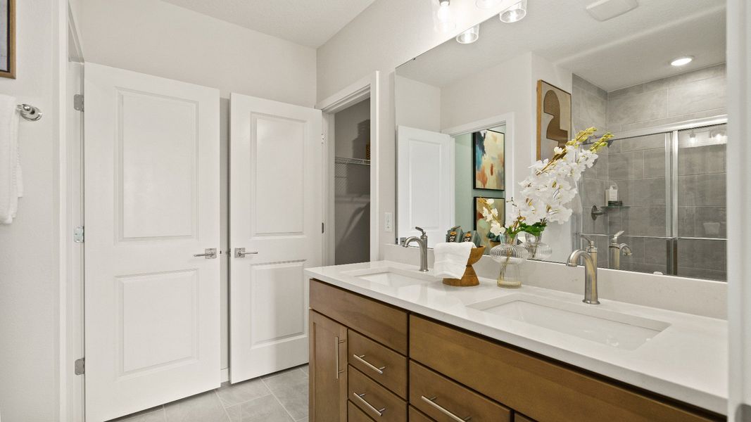 Castaway Model Home Primary Suite, en suite bath with dual sinks new home plan available at Liberty Trace in Haines City, fl