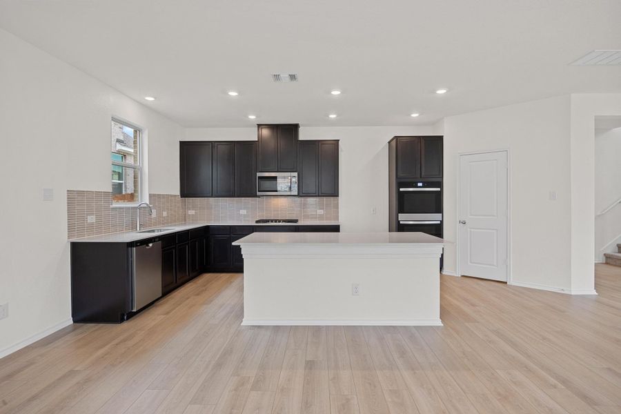 Furnished interior view inside a new home in Salerno - Classic Collection, Round Rock (Image 6). Furnished interior view inside a new home in Salerno - Classic Collection, Round Rock (Image 6).