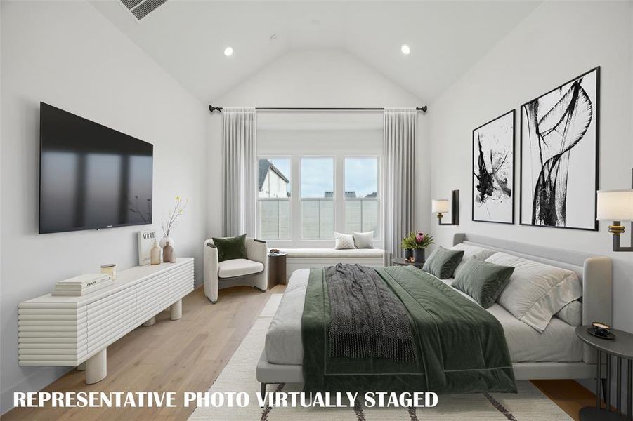 Featuring high ceilings, a wall of windows and built in window seat, this owner's suite is a dream come true!  REPRESENTATIVE PHOTO VIRTUALLY STAGED