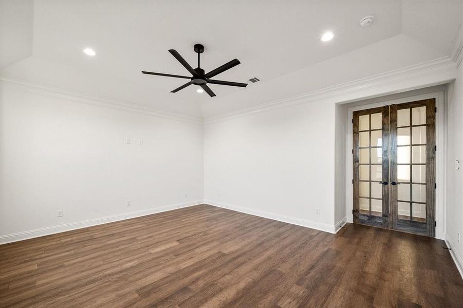 The pan ceiling and french doors make the office inviting!
