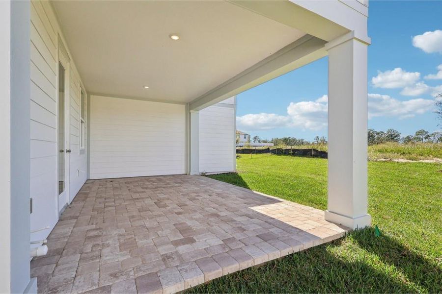 Exterior details and patio area of a home in Northlake Traditional, Winter Garden (Image 18). Exterior details and patio area of a home in Northlake Traditional, Winter Garden (Image 18).